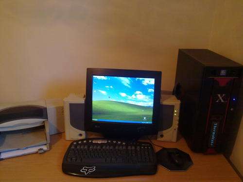 Dektop AMD pc with screen printer keyboard and mouse.