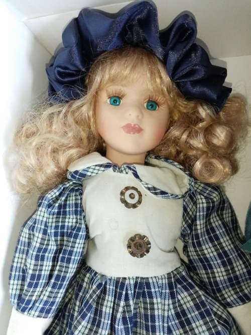 2 Beautiful Porcelain Dolls