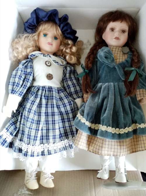 2 Beautiful Porcelain Dolls