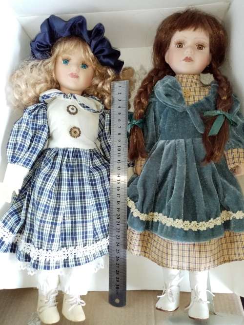 2 Beautiful Porcelain Dolls