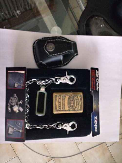 4 Heavy Plated never used Zippo's, 1 rare used Jack Daniels with chain and pouch. Free Shipping!