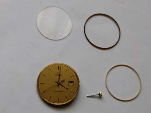 Omega Seamaster dial, crown, movement, crystal, and gaskets.