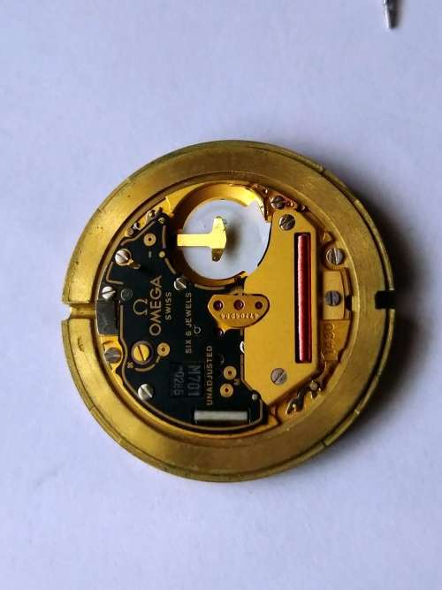 Omega Seamaster dial, crown, movement, crystal, and gaskets.