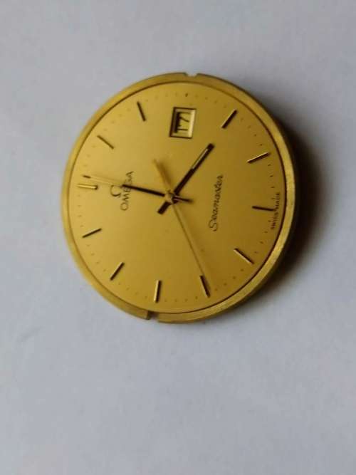 Omega Seamaster dial, crown, movement, crystal, and gaskets.