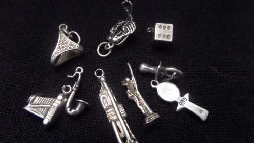 9 x Silver Charms (not all are marked but tested silver)