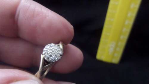 9 ct Gold Ring with a Cluster of small Diamonds Dim 16mm 2.3 grams ( note 1 small diamond missing)