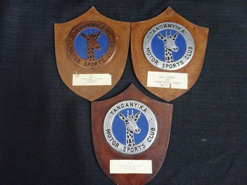 Seven Tanganyika Motor Sports Club Badges And Plagues (H - 16cm / B - 12.5cm)