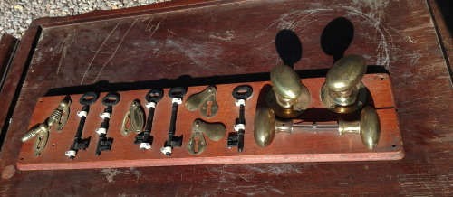 OLD DOOR HANDLES AND KEYS DISPLAY.