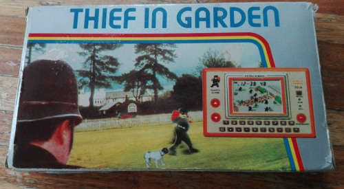 VINTAGE HAND HELD COMPUTER GAME. THIEF IN GARDEN.