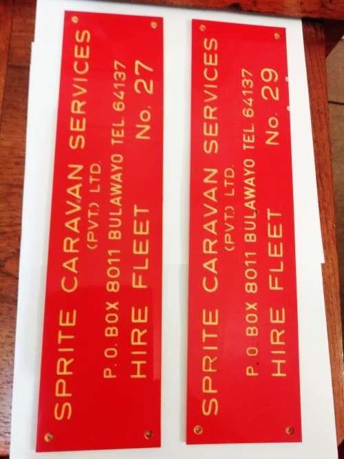 TWO RHODESIA SIGNS.