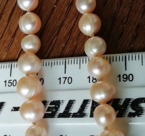 STRING OF PEARLS NECKLACE.