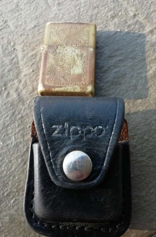 VINTAGE ZIPPO LIGHTER, AND LEATHER POUCH
