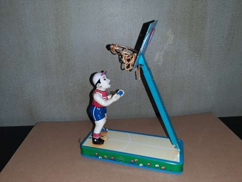 Vintage tin toy basketball player
