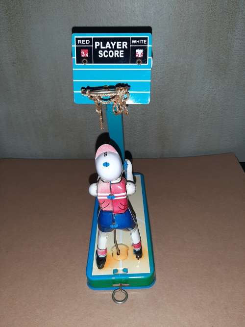 Vintage tin toy basketball player