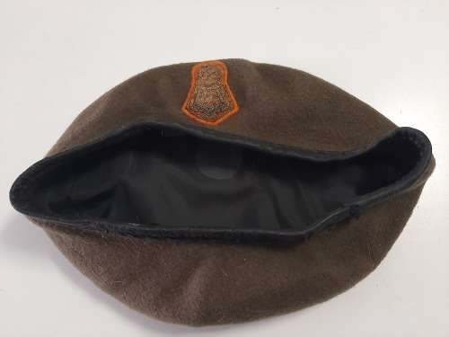 Military beret with embroidered badge
