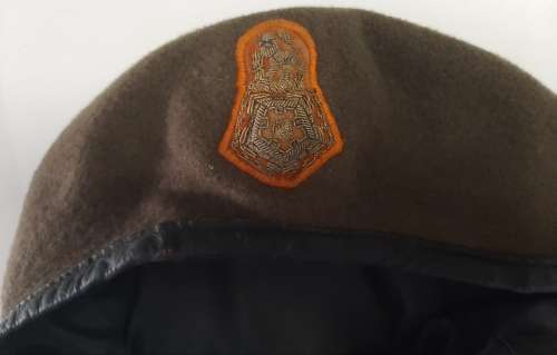 Military beret with embroidered badge