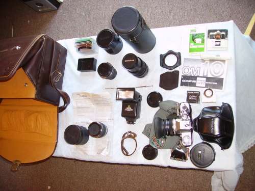 OLYMPUS OM10 CAMERA WITH BAG AND "FULL HOUSE LENSES AND ACCESSORIES - GREAT VALUE