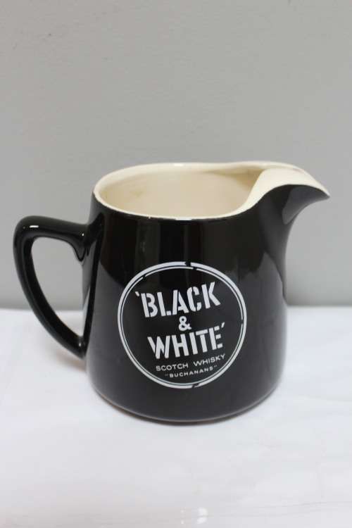 Milk jug with a whiskey logo