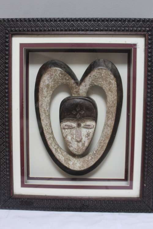 Box framed 3D African head carved from stone