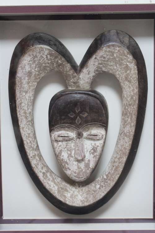 Box framed 3D African head carved from stone