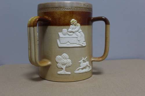 Royal Doulton big mug with a sterling silver trim