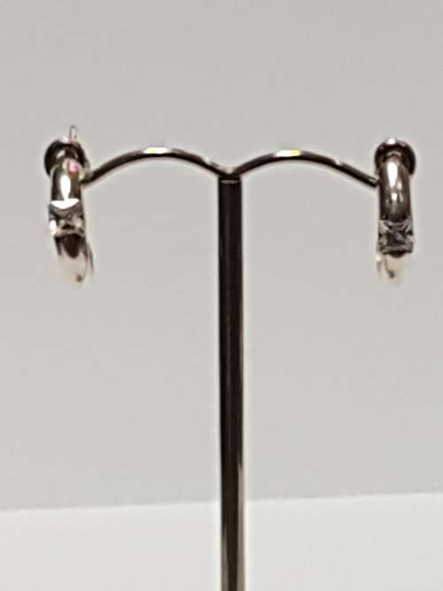 Sterling silver round earrings with 1 x princess zirconia in each