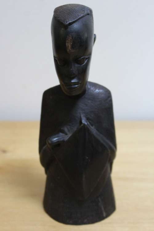 A pair of small African carved wooden figures