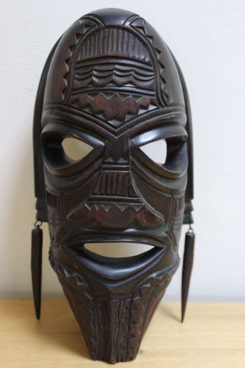 Central African carved wooden mask - There is a slight scuff mark on the head/top