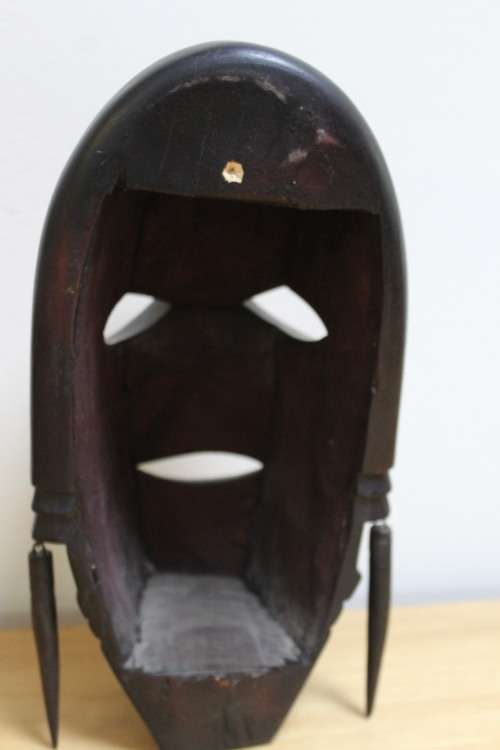 Central African carved wooden mask - There is a slight scuff mark on the head/top