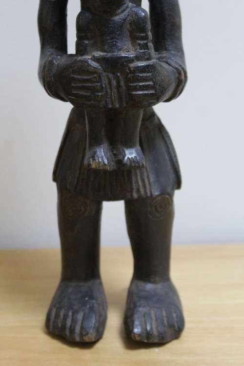 Central African carved wooden figure of a mother holding her baby