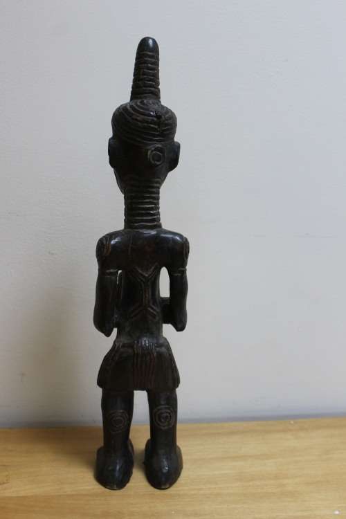 Central African carved wooden figure of a mother holding her baby