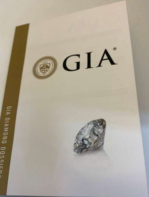 9ct (3.1grams) Yellow Gold Ring with 0.60ct Round Brillant K SI1 with smalls - GIA certificate