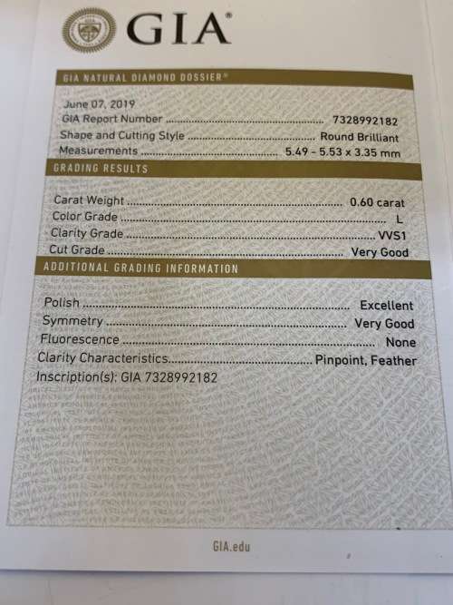 18ct (8.1grams) White Gold Round 0.60ct Brilliant Diamond L VVS2 c/w Baguettes - GIA certificate