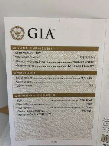 18ct 4.1gr White Gold 0.71ct Marquise Cut I SI2 with 1 x Baguette set on either side with GIA cert