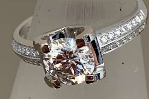 18ct ( 3.9grams) White Gold 1.17ct Round Brilliant Diamond Ring set with small diamonds on the side