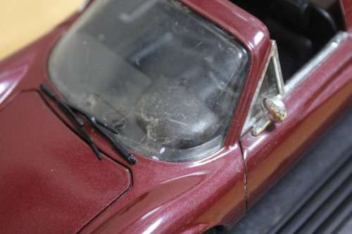 Collectible mini Ferrari - not in mint condition - can be used for spare parts