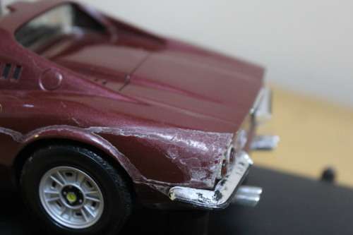 Collectible mini Ferrari - not in mint condition - can be used for spare parts