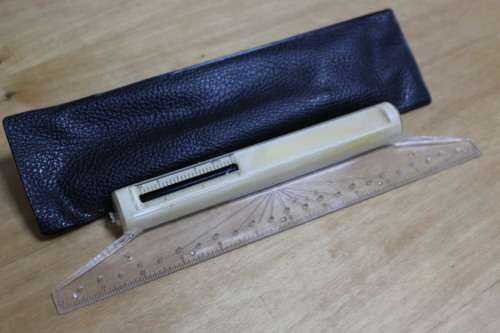 vintage rolling ruler in pouch