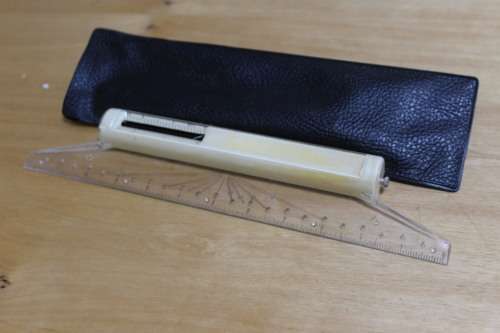 vintage rolling ruler in pouch