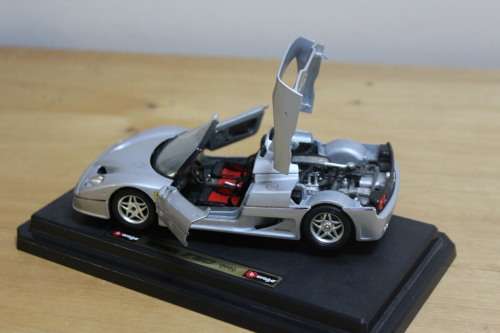 Collectible Burago mini Ferrari F50 - not in mint condition - can be used for spare parts