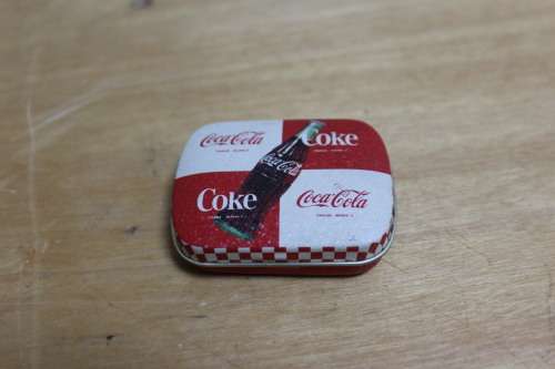Collectible Coca-Cola memorabilia - small vintage container