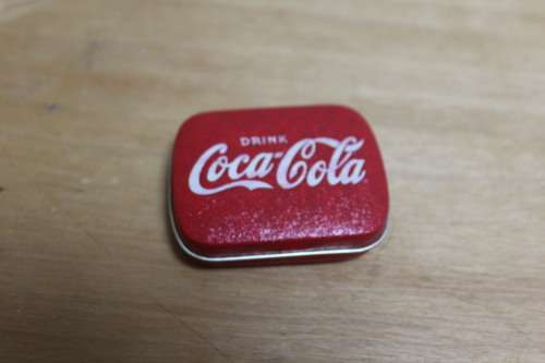 Collectible Coca-Cola memorabilia - small vintage container