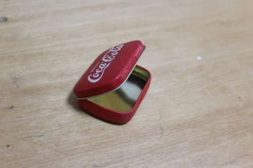 Collectible Coca-Cola memorabilia - small vintage container