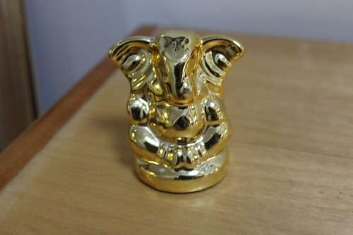 Small little plastic/resin gold Elephant