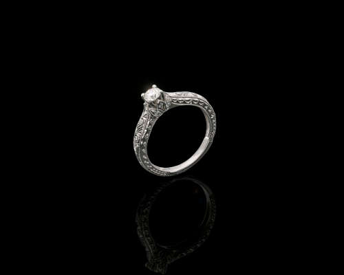 9ct, 3.2gr White Gold,0.27ct Round Brillant Diamond K SI1 with smalls on the band