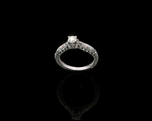 9ct, 3.2gr White Gold,0.27ct Round Brillant Diamond K SI1 with smalls on the band