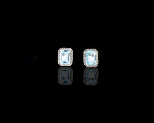 2 grams 9 carat White Gold Blue Topaz and Diamond Stud Earrings