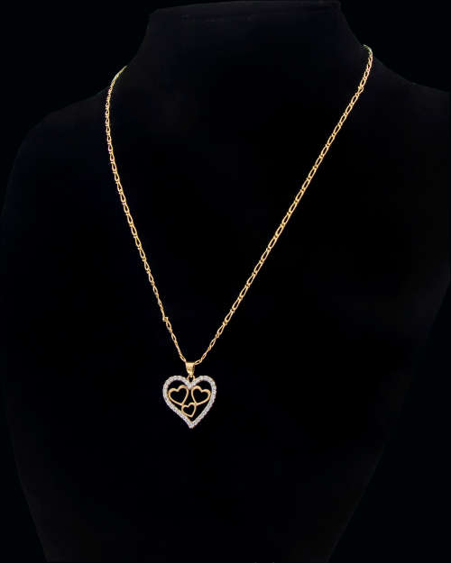3.6 grams   Total Weight 9 carat Yellow Gold Chain and Cubic Zirconia Heart Pendant
