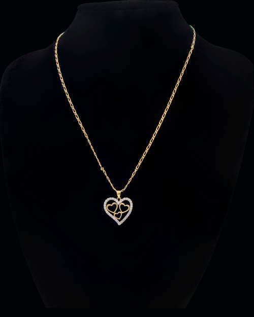 3.6 grams   Total Weight 9 carat Yellow Gold Chain and Cubic Zirconia Heart Pendant