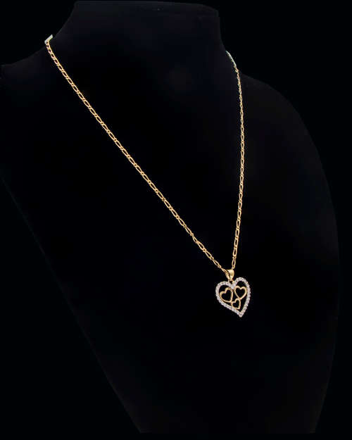 3.6 grams   Total Weight 9 carat Yellow Gold Chain and Cubic Zirconia Heart Pendant